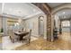 Formal dining room with a chandelier, a large dining table, and elegant decor and design details at 9747 Cathedral Pines Ave, Las Vegas, NV 89149