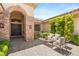 Charming courtyard with outdoor seating and a stone facade at 9747 Cathedral Pines Ave, Las Vegas, NV 89149