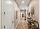Inviting hallway with tiled floors and decorative shelving, seamlessly connecting living spaces at 9747 Cathedral Pines Ave, Las Vegas, NV 89149