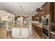 Well-equipped kitchen featuring a granite island, stainless steel appliances, and ample storage space at 9747 Cathedral Pines Ave, Las Vegas, NV 89149