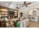 Open-concept living room featuring a stone fireplace, built-in shelving, and modern furnishings at 9747 Cathedral Pines Ave, Las Vegas, NV 89149