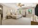 Serene main bedroom with tray ceiling, plush carpeting, and a peaceful ambiance at 9747 Cathedral Pines Ave, Las Vegas, NV 89149