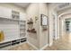 Organized mud room featuring custom shelving and storage solutions, perfect for entry convenience at 9747 Cathedral Pines Ave, Las Vegas, NV 89149