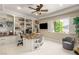 Well-appointed office with custom built-ins, granite desk, and natural light perfect for productivity at 9747 Cathedral Pines Ave, Las Vegas, NV 89149