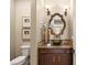 Stylish powder room features a unique vessel sink, decorative mirror, and warm lighting at 9747 Cathedral Pines Ave, Las Vegas, NV 89149