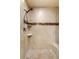 Detailed view of a tiled walk-in shower with a built-in bench at 9747 Cathedral Pines Ave, Las Vegas, NV 89149
