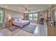 Serene main bedroom with a ceiling fan, lots of space and ensuite bathroom access at 9785 W Meranto Ave, Las Vegas, NV 89178