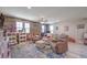 Spacious bonus room featuring wood floors, natural light, and plenty of room for multiple seating areas at 9785 W Meranto Ave, Las Vegas, NV 89178
