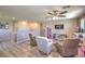 Spacious living room with hardwood floors, ceiling fan, and access to other rooms at 9785 W Meranto Ave, Las Vegas, NV 89178