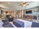 Cozy living room with wood floors, neutral paint, and a view of the staircase at 9785 W Meranto Ave, Las Vegas, NV 89178