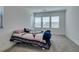Bright bedroom features a bed, carpet, and bright windows at 9844 Kings Glen St, Las Vegas, NV 89141