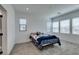 Bedroom features a carpet, bed, and bright windows at 9844 Kings Glen St, Las Vegas, NV 89141