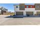 Modern two-story townhome featuring a private two-car garage and contemporary design at 9844 Kings Glen St, Las Vegas, NV 89141