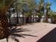 Low maintenance backyard features desert landscaping and mature palm trees for privacy at 1018 Sun Poppy Ave, Las Vegas, NV 89123