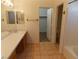 Spacious bathroom featuring a large countertop, sink, and tiled flooring at 1018 Sun Poppy Ave, Las Vegas, NV 89123
