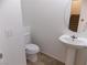 Half bathroom with modern pedestal sink and tiled flooring at 1018 Sun Poppy Ave, Las Vegas, NV 89123