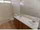 Bathroom with dual sinks and vanity with tub and shower combination at 1018 Sun Poppy Ave, Las Vegas, NV 89123