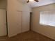 Bedroom featuring a window and a large closet with sliding doors at 1018 Sun Poppy Ave, Las Vegas, NV 89123