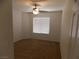 This bedroom features a ceiling fan and a window with blinds for adjustable light and privacy at 1018 Sun Poppy Ave, Las Vegas, NV 89123