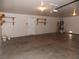 Spacious garage with a water heater, shelving, and door leading to the house at 1018 Sun Poppy Ave, Las Vegas, NV 89123