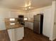 Bright kitchen with stainless steel appliances, granite countertops, and white cabinetry at 1018 Sun Poppy Ave, Las Vegas, NV 89123