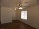The spacious living room features a ceiling fan and natural light from the window at 1018 Sun Poppy Ave, Las Vegas, NV 89123