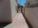 Side yard features a brick-paved walkway, enhancing accessibility to the property at 1018 Sun Poppy Ave, Las Vegas, NV 89123