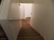 Carpeted staircase leading to the upper level provides safe access to bedrooms and living areas at 1018 Sun Poppy Ave, Las Vegas, NV 89123