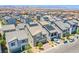 New development showing gray homes with solar panels and mountain views on a sunny day at 10435 Rose Palisade St, Las Vegas, NV 89141
