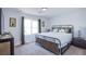 Bedroom with large window, stylish metal bed frame, and neutral decor at 10435 Rose Palisade St, Las Vegas, NV 89141