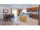 Modern kitchen featuring granite countertops, stainless steel appliances, and an island with bar seating at 10435 Rose Palisade St, Las Vegas, NV 89141