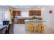 Modern kitchen featuring granite countertops, stainless steel appliances, and an island with bar seating at 10435 Rose Palisade St, Las Vegas, NV 89141