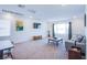 Spacious living area featuring plush seating, a large window, a TV, and lots of room to gather at 10435 Rose Palisade St, Las Vegas, NV 89141