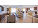 Bright and airy living room with hardwood floors, contemporary furniture, and plenty of natural light at 10435 Rose Palisade St, Las Vegas, NV 89141