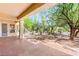 Back patio featuring desert landscaping and partial golf course views at 10548 Findlay Ave, Las Vegas, NV 89134
