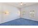 Bedroom with blue carpet, striped wallpaper and natural light at 10548 Findlay Ave, Las Vegas, NV 89134