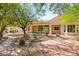 Beautiful home with a desert landscape, covered porch, and stone accents at 10548 Findlay Ave, Las Vegas, NV 89134