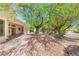 Inviting front yard showcasing native landscaping and a covered patio at 10548 Findlay Ave, Las Vegas, NV 89134