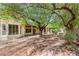 Charming desert front yard with mature trees, rock accents and covered patio at 10548 Findlay Ave, Las Vegas, NV 89134