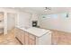 Bright kitchen features a large island and fireplace, perfect for cooking and entertaining at 10548 Findlay Ave, Las Vegas, NV 89134