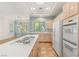 Eat-in kitchen features ample countertops and cabinetry, modern appliances, and tile flooring at 10548 Findlay Ave, Las Vegas, NV 89134