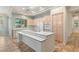 Light filled kitchen showcases a functional island with built in seating at 10548 Findlay Ave, Las Vegas, NV 89134