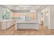 Eat in kitchen showcases a large island with cooktop and modern white appliances at 10548 Findlay Ave, Las Vegas, NV 89134