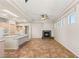 The living room is adjacent to the kitchen and contains a stone fireplace at 10548 Findlay Ave, Las Vegas, NV 89134