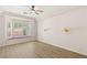 This spacious main bedroom boasts a large window bench and modern ceiling fan at 10548 Findlay Ave, Las Vegas, NV 89134