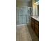 Bathroom featuring a glass-enclosed shower, tile floor, and single sink vanity at 11404 Belmont Lake Dr # 103, Las Vegas, NV 89135