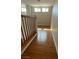 Hallway with wood flooring and railing at 11404 Belmont Lake Dr # 103, Las Vegas, NV 89135