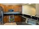 The kitchen has stainless steel appliances and granite countertops at 11404 Belmont Lake Dr # 103, Las Vegas, NV 89135