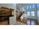 Bright living room features wood floors, high ceilings, and a decorative chandelier at 11404 Belmont Lake Dr # 103, Las Vegas, NV 89135