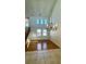 Open-plan living area with tall ceilings and a decorative chandelier at 11404 Belmont Lake Dr # 103, Las Vegas, NV 89135